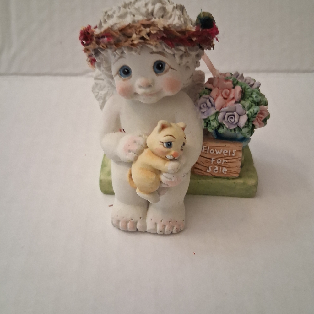 Dreamsicles cherub figurine, likely titled "Where Love Grows" from 1998.
